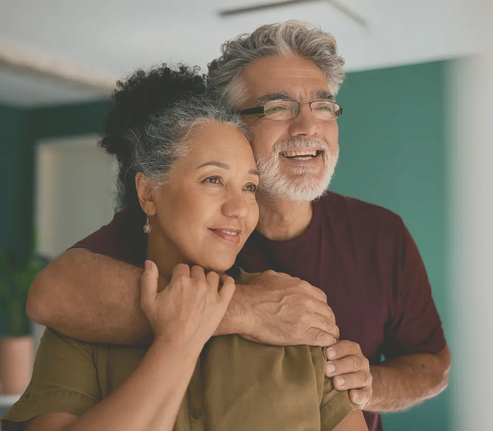Happy couple embracing and smiling